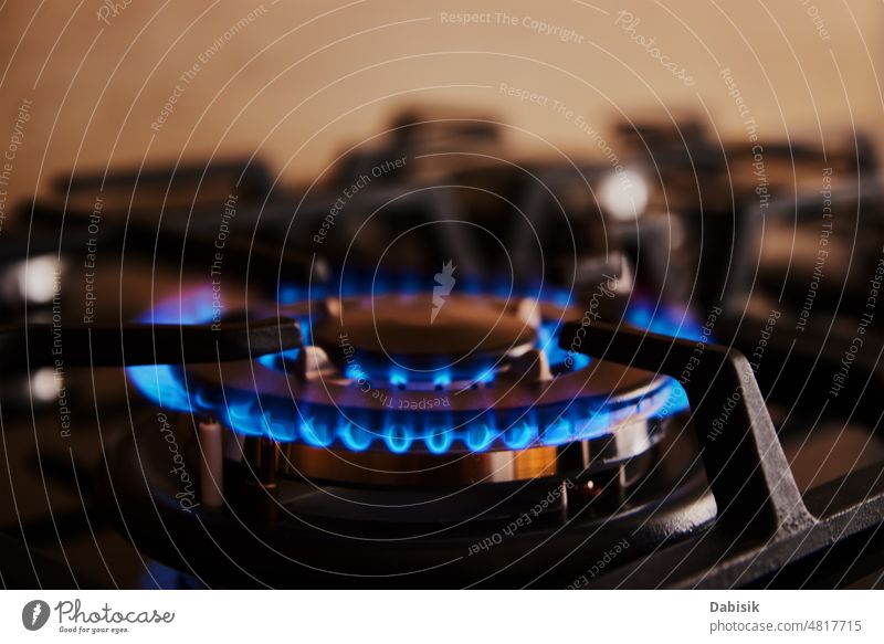 Natural gas burner and large orange and blue flame