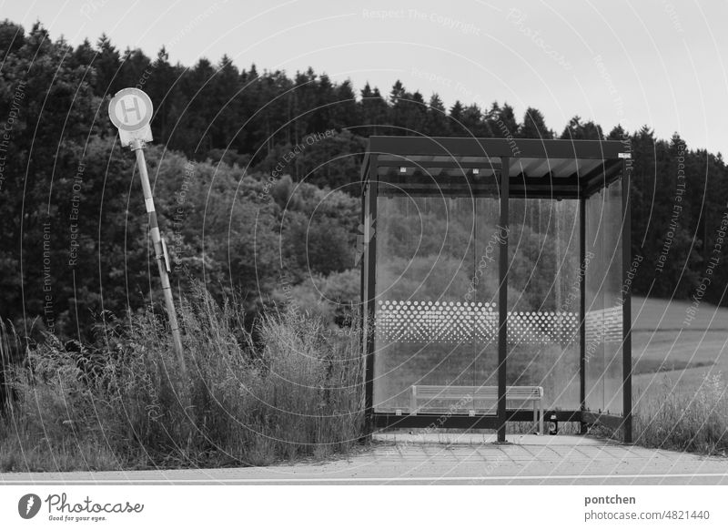 Country life. An abandoned bus stop. Crooked bus stop sign. Black and white. Public transport Bus stop Stop (public transport) slanting forsake sb./sth.