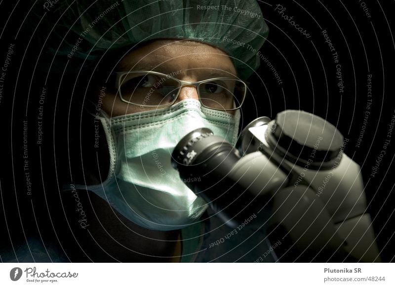 Dr. in the Dark Health care Doctor Eyeglasses Microscope Mask Colour photo Interior shot Detail Copy Space left Copy Space top Neutral Background