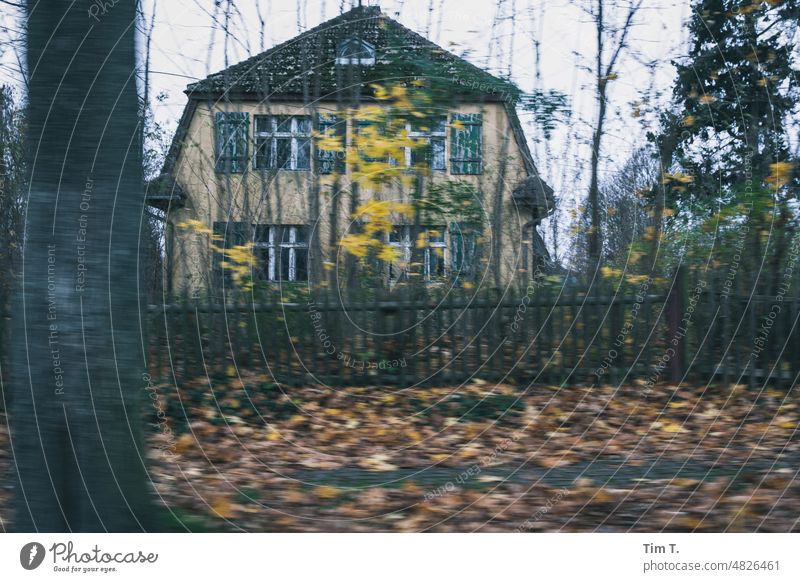 an old house behind a wooden fence in autumn House (Residential Structure) Autumn Fence Exterior shot Deserted Day Colour photo Building border Berlin