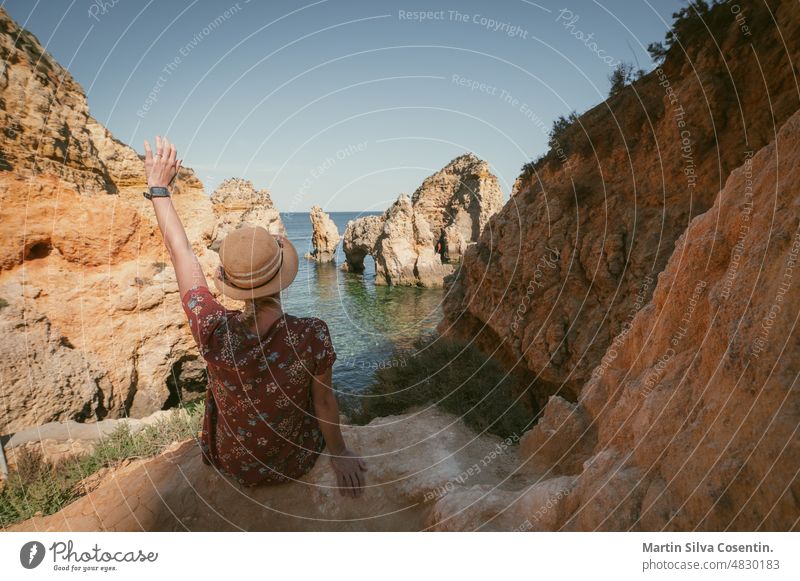 Blonde Woman in the Algarve, Portugal in the summer of 2022. algarve architecture atlantic bay beach blue boat boats building city cliff coast coastline