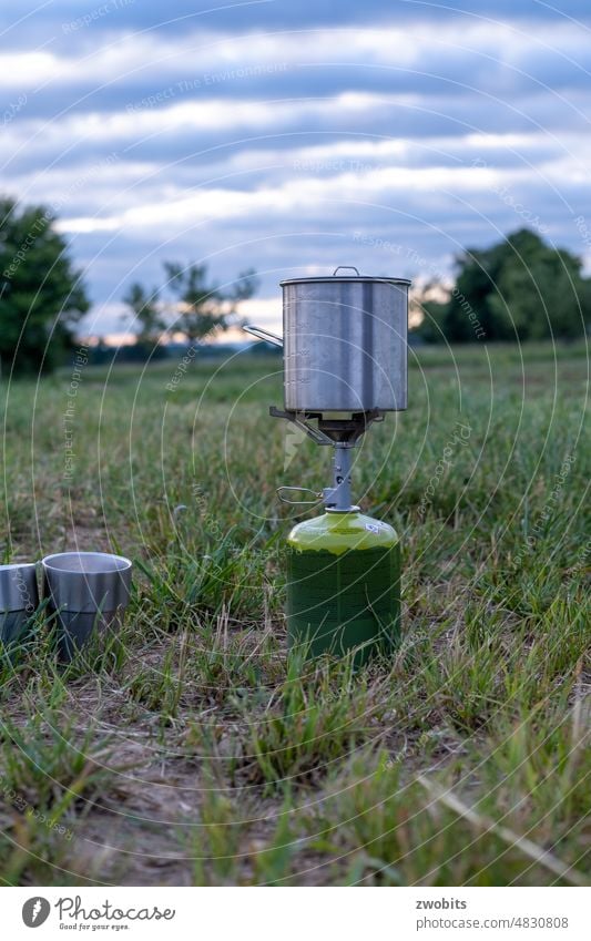 Gas stove, pot and mug in the morning in a meadow in use. gas cooker outdoor Hiking Nature Adventure Tea boil Exterior shot Vacation & Travel Colour photo