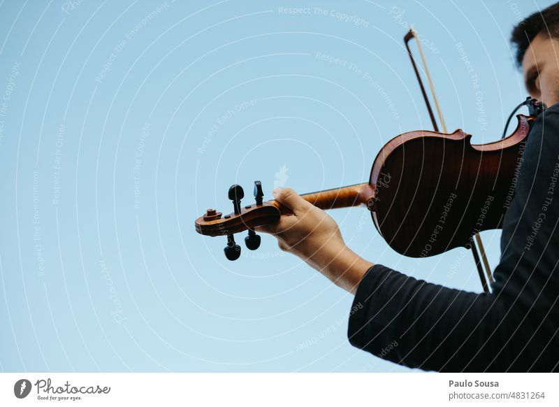 Man playing violin on stage Violin Violinist Music Musician Musical instrument Orchestra Stage Colour photo Detail Listen to music String instrument