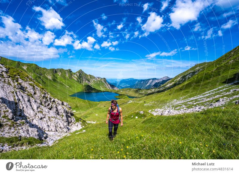 Woman hiking to box head - a Royalty Free Stock Photo from Photocase
