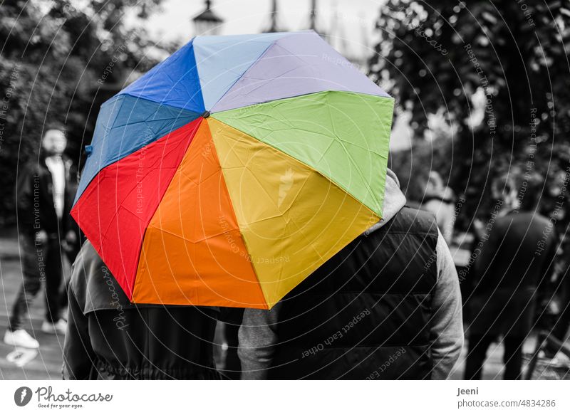 Two under the colorful umbrella of life Umbrella variegated Rain Prismatic colors Weather Protection Wet colored people Umbrellas & Shades black-and-white