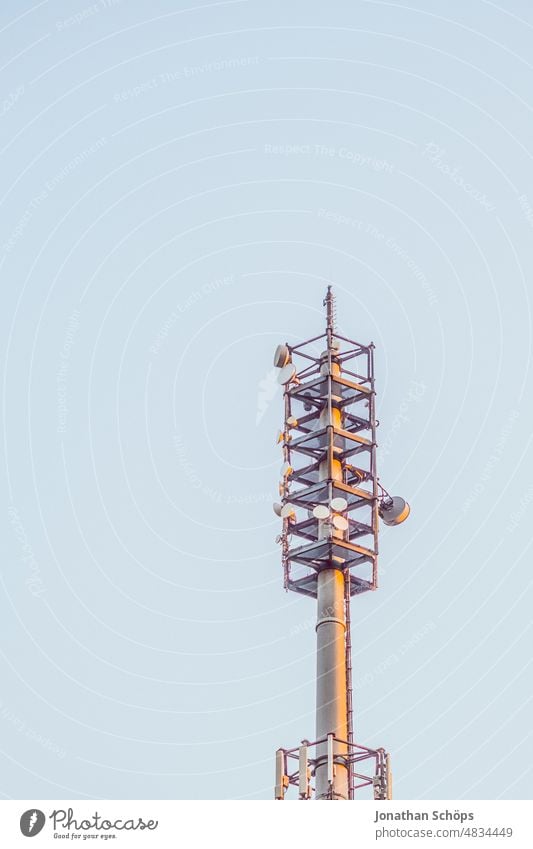 Radio mast for cell phone reception cell phone in front of blue sky 3G 4G 5g 5G Expansion 5G radiation Data protection digitization EMF Electromagnetic fields