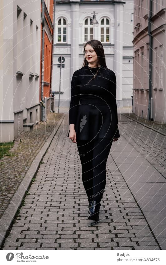 Young woman walking through alley and looking to the side portrait Woman Feminine Face pretty Human being Hair and hairstyles Youth (Young adults) Long-haired