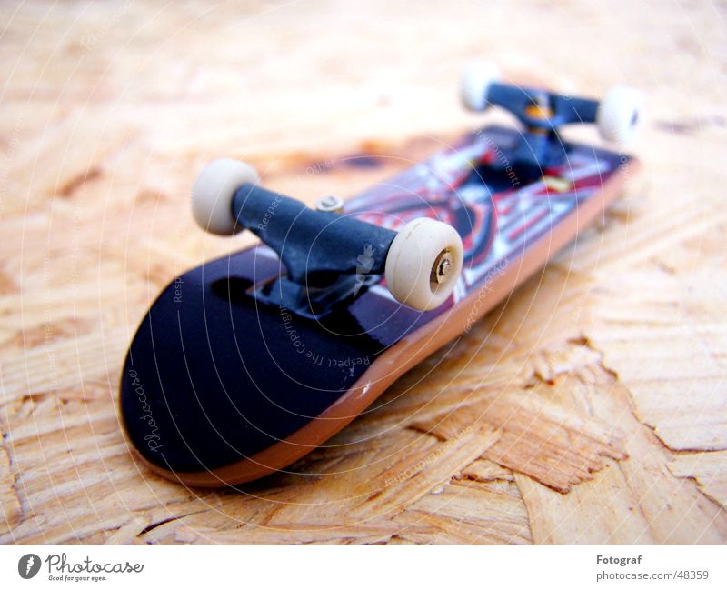 Fingerboard. Skateboarding Wood flour Road adherence Perspiration Macro (Extreme close-up) Sports Depth of field Wooden board wheel Funsport Extreme sports