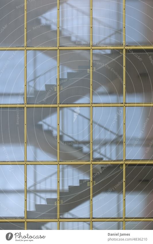 Stairwell through yellow grid Stairs stairwell staircase Architecture Multistory Grid Yellow Pattern repetition Handrail Winding staircase Internal glass facade