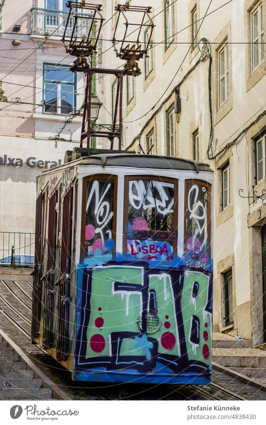 Graffiti sprayed funicular from the 19th century Lisbon Street Transport Railroad tracks Tram writing Characters Letters (alphabet) Daub Creativity variegated