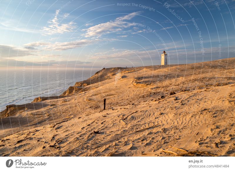 the silted lighthouse at sunset Rubjerg Knude Fyr Lighthouse Wanderdüne Rubjerg Knude Denmark Beach dune coast North Sea Tourist Attraction Vacation & Travel