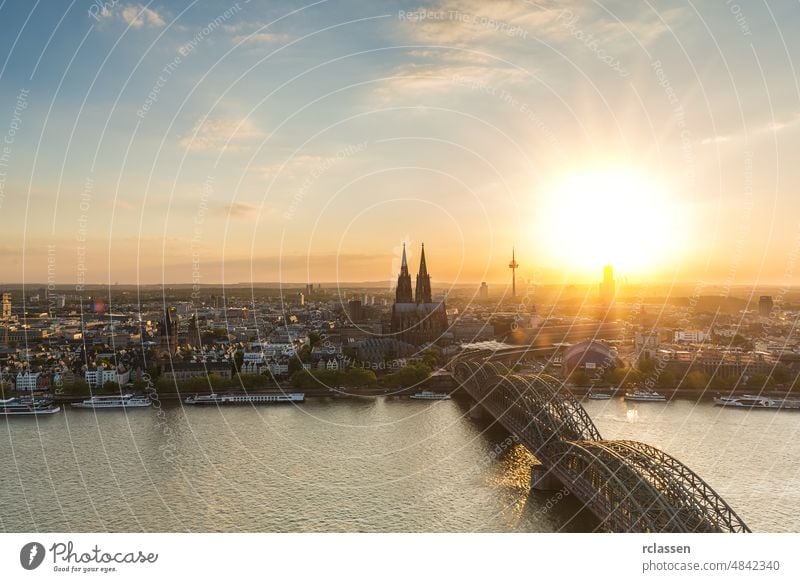 Sunset over Cologne city in germany cologne cologne cathedral old town Cathedral sun Rhine Hohenzollern bridge Germany dom river carnival kölsch church summer