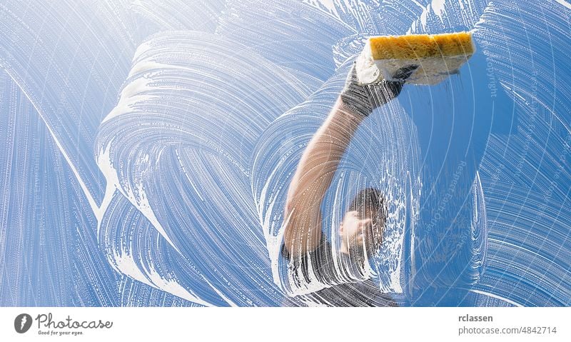 Hand Cleaning With Squeegee Against A White Background Stock Photo