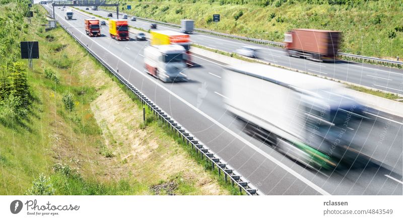 Traffic on highway with cars transport truck road vehicle street germany logistic lorry traffic freight green urban summer cargo blue sky horizon nature driving