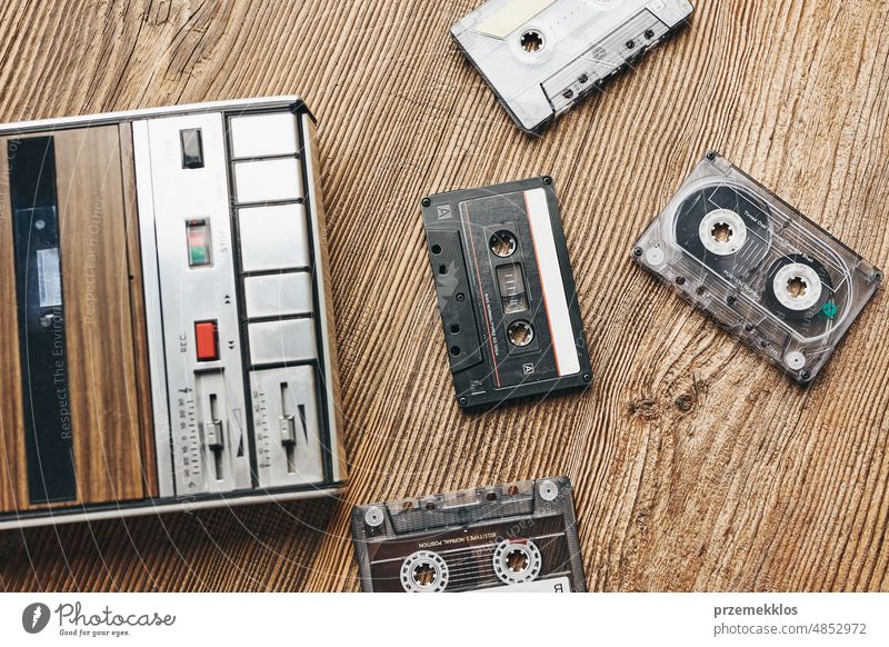 Compact cassette tapes and cassette recorder. Retro music style. 80s music party. Vintage style. Analog equipment. Stereo sound. Back to the past compact player