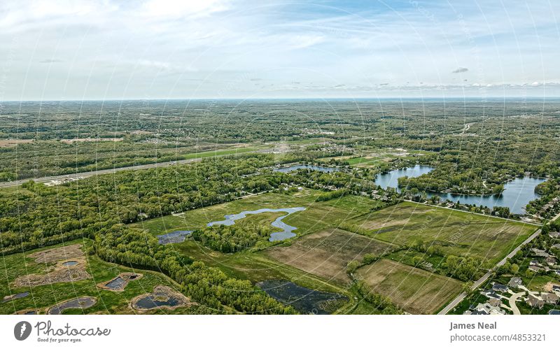 Spring view over rural portion of brown county wisconsin horizon sunny natural peaceful nature reflection day beauty lake background summer road outdoors