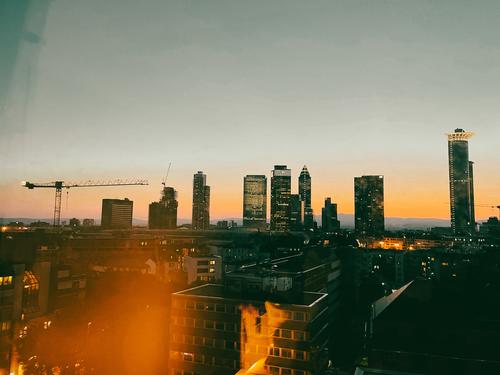 Frankfurt skyline with skyscrapers in the evening twilight Skyline High-rise Architecture Bank building City Dusk Night Vantage point Town urban Crane Downtown