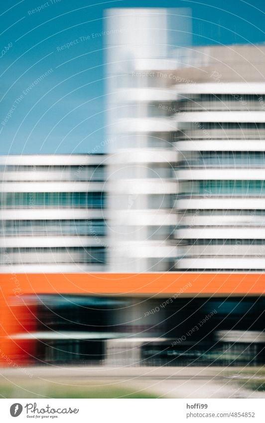 abstract, vibrant and blurred facade of modern architecture against blue background Unsharp blurred ICM ICM technology Modern architecture vibrating