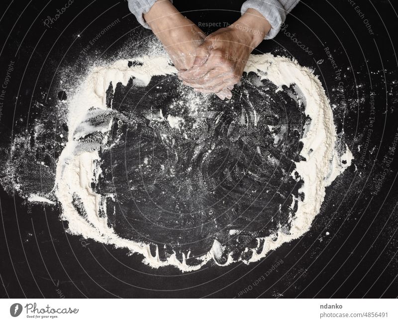 https://www.photocase.com/photos/4856491-sifted-white-wheat-flour-on-a-black-table-and-two-female-hands-top-view-cooking-at-home-photocase-stock-photo-large.jpeg