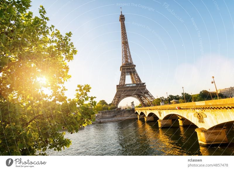 Seine in Paris with Eiffel tower in sunrise time paris eiffel landmark france skyline europe sun flare summer seine view travel romantic city river sunset