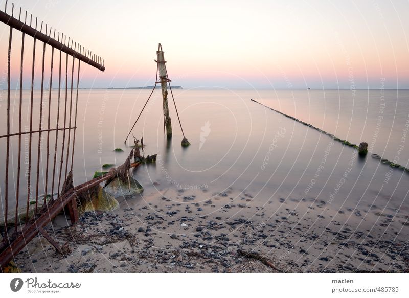 pink morning Nature Landscape Sky Cloudless sky Horizon Sun Sunrise Sunset Autumn Weather Beautiful weather Coast Beach Ocean Fence Stone Sand Blue Gray Pink