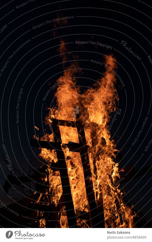 burning christian crosses in pagan festival fire bonfire night ancient ritual wooden cross burning cross midsummer solstice solstice night heretics catholic