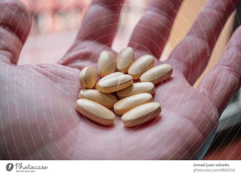 painkillers pills on the hand medicine medical analgesic health health care pharmacy tablet drug pharmaceutical medication capsule treatment addiction