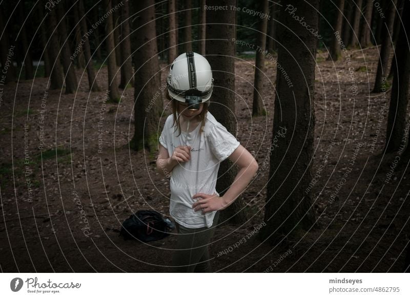 The cave explorer - girl with helmet and lamp in the forest Forest Girl Adventure Helmet Lamp Lonely Dark Exterior shot trees tree trunks Equipment Climbing