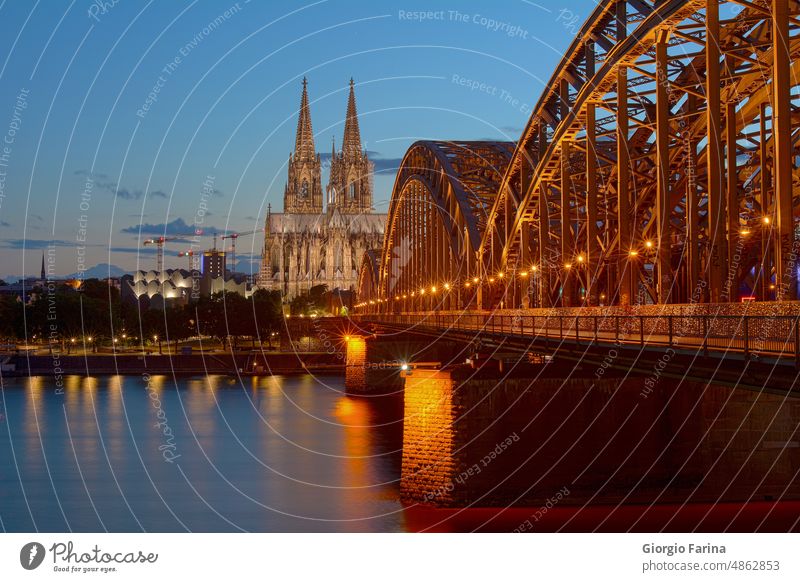 Cologne Cathedral and Hohenzollern Bridge at dusk Rhine Tourist Attraction Dome Landmark Evening Night