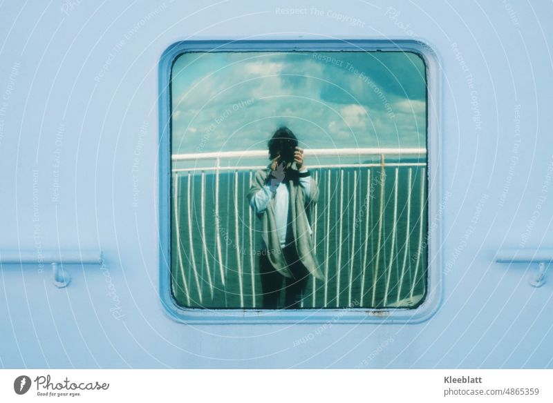 Selfie - or reflection in a window on the ferry in the background is the sea and the clouds with railing Window boat Ferry ship Woman Woman with scarf