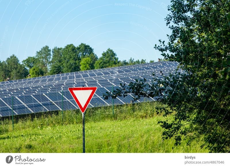 Right of way - respect - sign in front of a PV open space plant , photovoltaic open space plant in front of cloudless sky, PV modules photovoltaics PV system