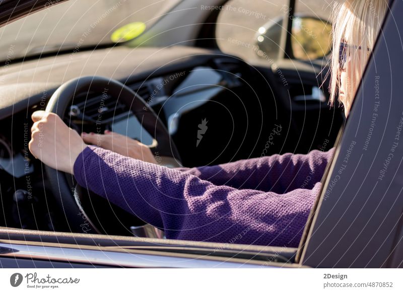 Closeup hands of woman,hand pushing on steering wheel honking horn person car driver road closeup vehicle auto traffic travel transportation angry female