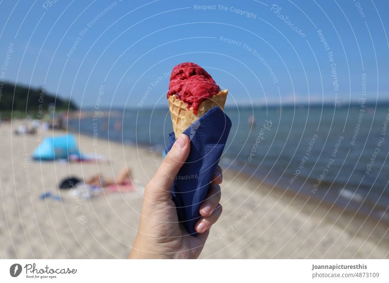 Raspberry ice cream in waffle in hand on beach Ice Summer Ice cream Food cute Nutrition Refreshment Delicious Dessert