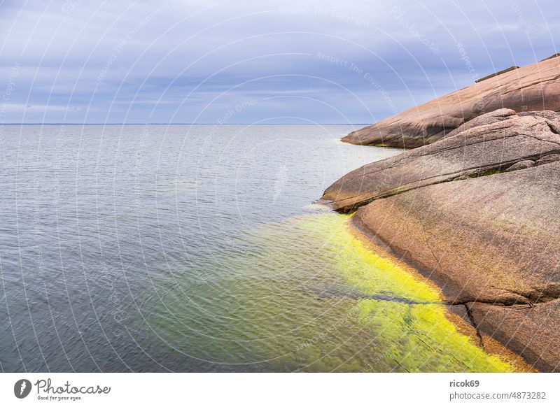 Baltic coast with rocks on island Blå Jungfrun in Sweden Island Oskarshamn Ocean Baltic Sea Kalmar county Smaland Summer Sky Clouds Blue Landscape Nature Water