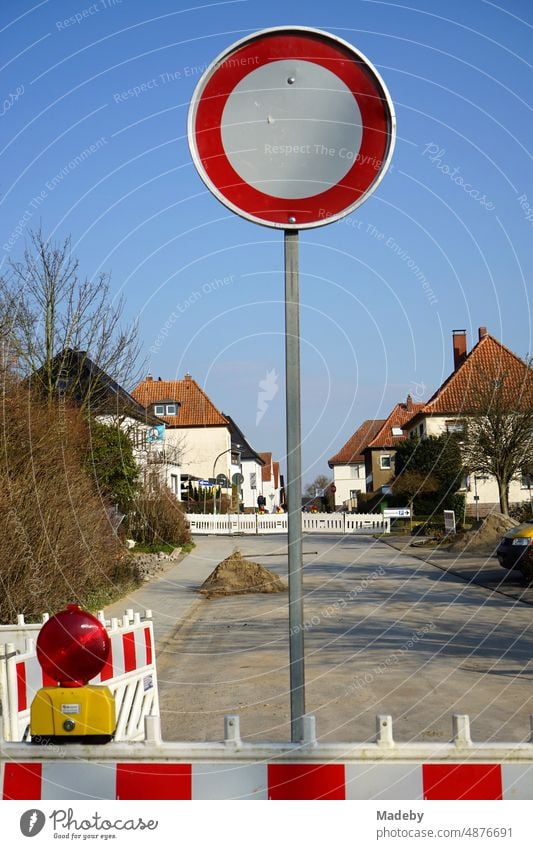 Passage forbidden with round traffic sign in front of blue sky in sunshine  at a construction site on a road in Blomberg in East Westphalia-Lippe,  Germany - a Royalty Free Stock Photo