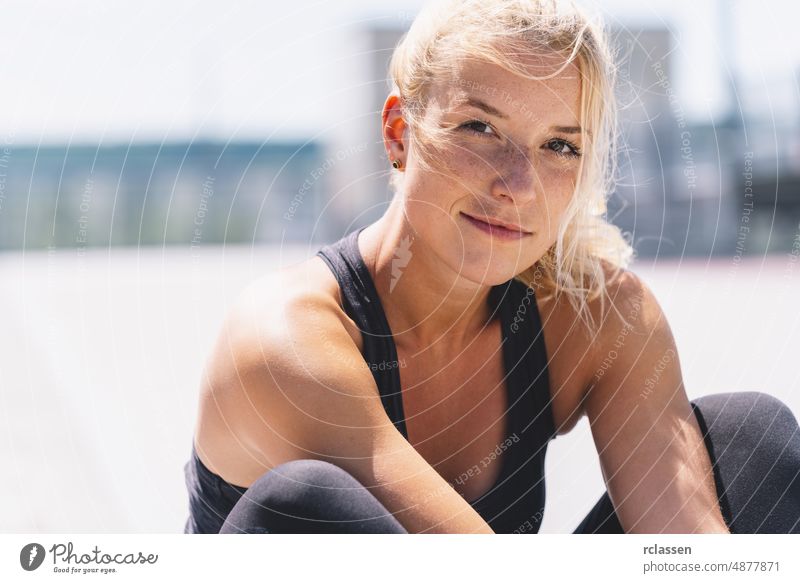 Happy attractive young woman in sportswear enjoying Relaxing after  training. Cheerful mood, true emotions, healthy lifestyle, smiling - a  Royalty Free Stock Photo from Photocase