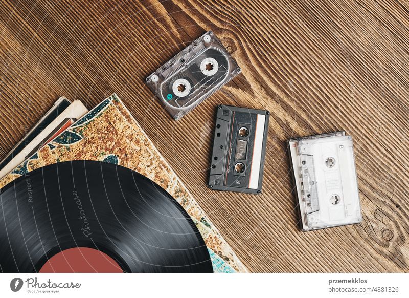 Vinyl records, cassette tapes and cassette recorder. Retro music style. 80s music party. Vintage style. Analog equipment. Back to the past vinyl compact retro