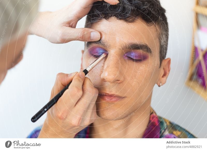 Transgender Man Getting Makeup Done By Boyfriend Couple Applying Eye Shadow Artist Cosmetic Gay Vanity Brush Together Palette Beautician Looking Away Beauty
