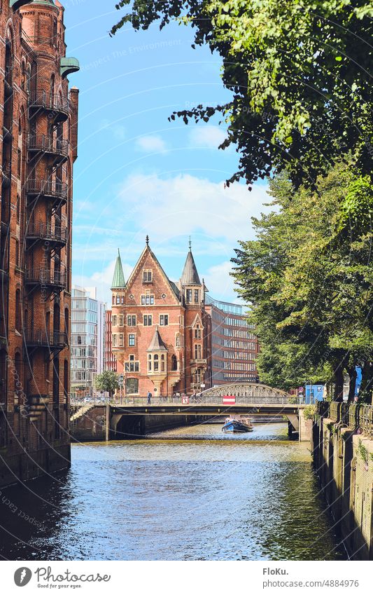 Speicherstadt Hamburg in summer Warehouses Historic Brick Architecture Old warehouse district Bridge Tourist Attraction Water Landmark Germany Building Channel