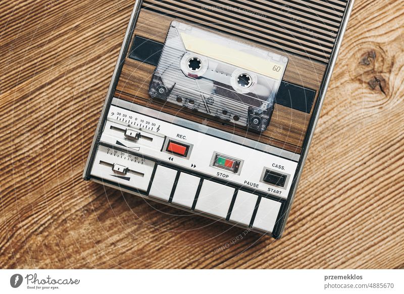 Compact cassette tapes and cassette recorder. Retro music style. 80s music party. Vintage style. Analog equipment. Stereo sound. Back to the past compact player
