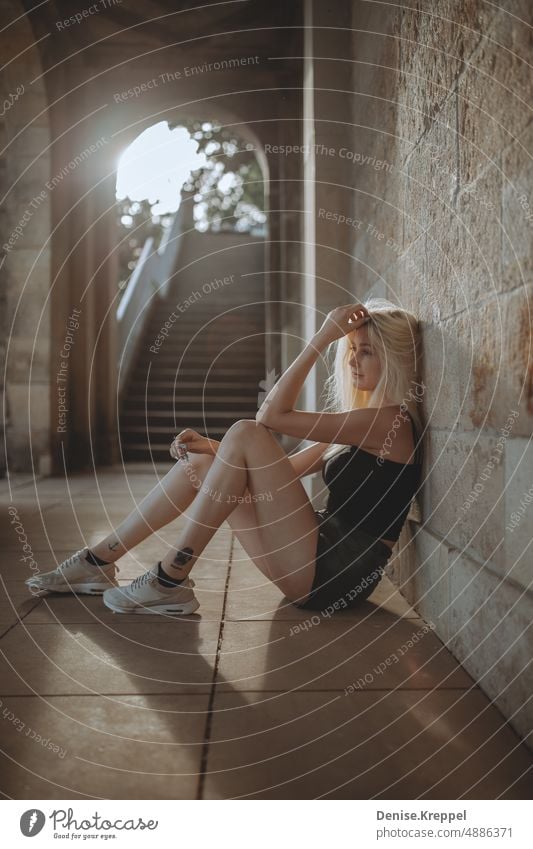 Woman relaxing against wall Face of a woman Woman's leg Girl power Idyll relaxed tranquillity relaxation Relaxation Summer free time holidays Joy Lifestyle pose