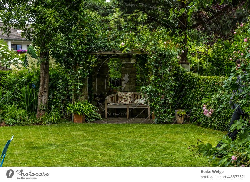Resting point in the garden Garden Green Plant Nature Leaf Bench Tree Calm Park bench Loneliness Relaxation Day Break Sit Deserted Grass Wooden bench Meadow