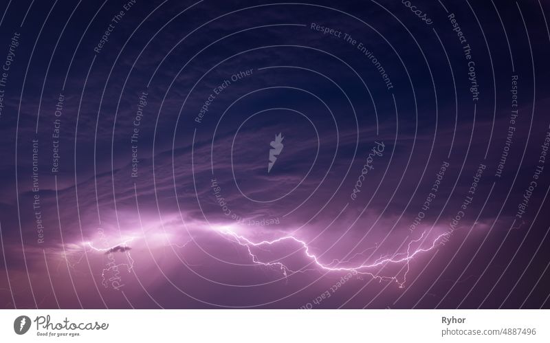 Bright Lightning On Purple Night Sky During Hunderstorm autumn backdrop background beautiful bright cloud cloudy copy space danger dark dramatic sky electric