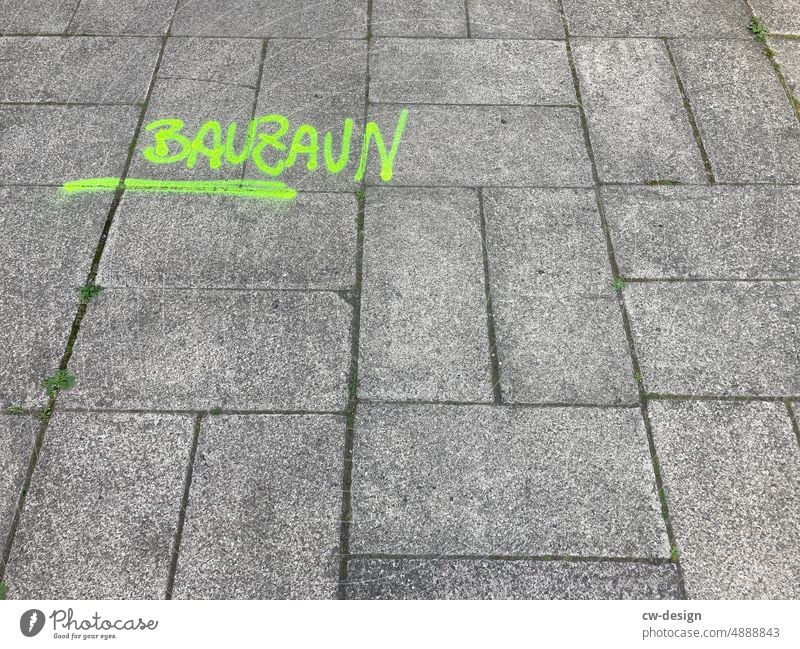 The word BAUZAUN on the asphalt Hoarding Green Asphalt off Street Lanes & trails Town Deserted Traffic infrastructure Exterior shot Footpath Sidewalk