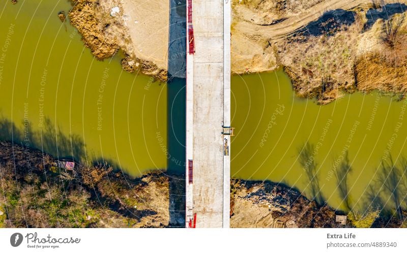 Aerial view on road over river under construction, building the bridge Above Across Architecture Base Beam Bridge Building Site Cement Civil Engineering