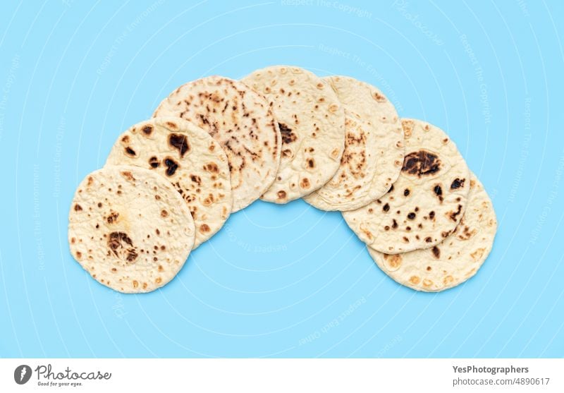 Naan bread pile on a blue table, top view. Homemade flatbread. above afghan arabic arranged asian background baked bakery classic color cuisine delicious