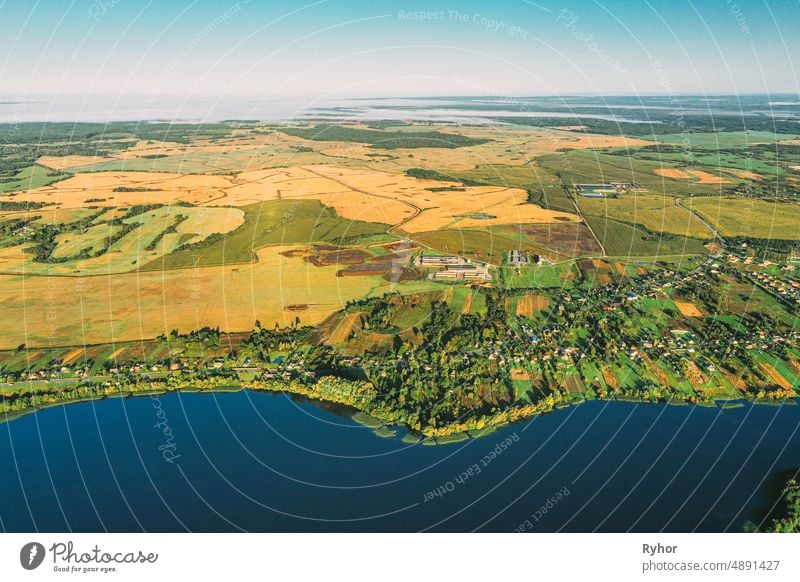 Lyepyel District, Vitebsk Region, Belarus. Aerial View Of Residential Area With Houses In Countryside. Morning Fog Above Lepel Lake And Town Skyline. Bird's Eye View