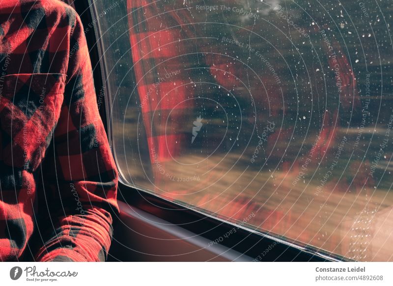Reflection of a man with red plaid shirt while driving in the window of a train. Human being Day Interior shot Haste motion blur Young man Speed Transience
