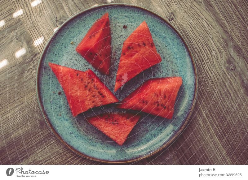 Red watermelon on blue plate Summer Water melon Blue Fruit Food Delicious cute Nutrition Fresh Colour photo Juicy naturally Slice Cut Melon Mature Sliced Tasty