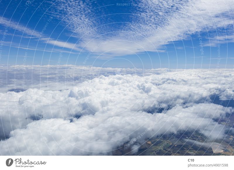 Hazy cirrostratus clouds in light blue sky Stock Photo